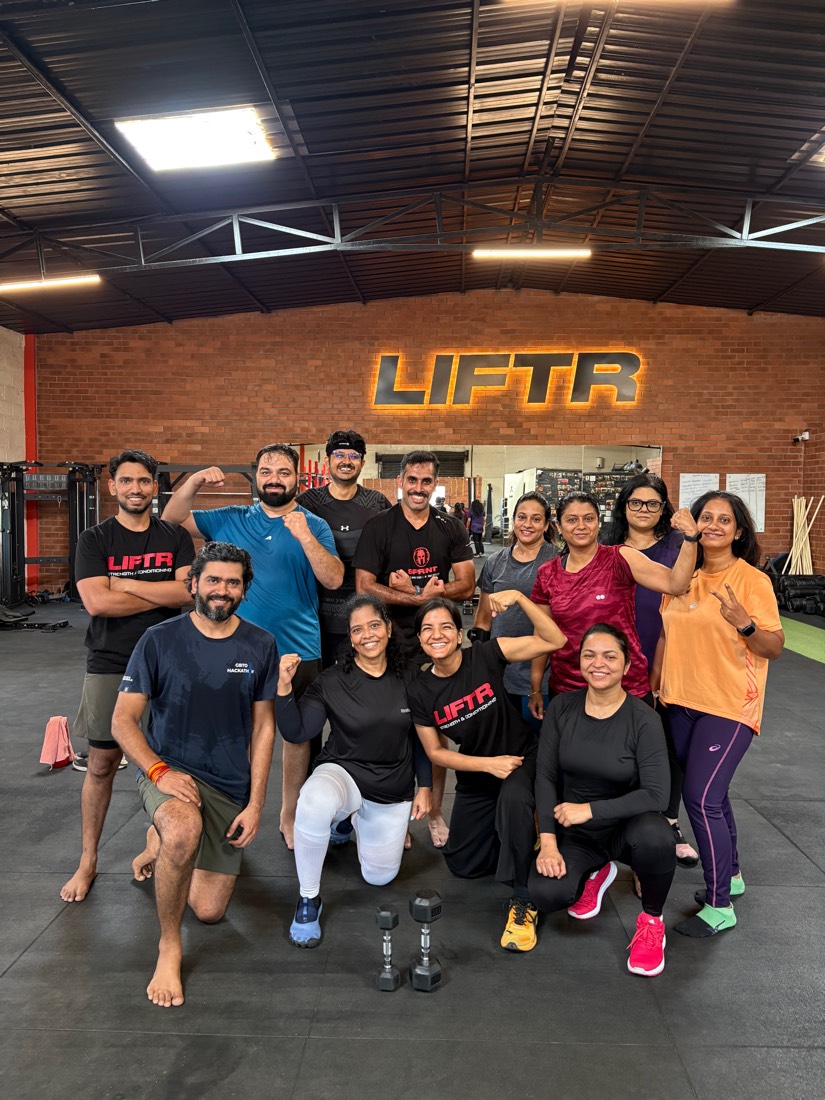 A LIFTR batch posing together on the gym floor